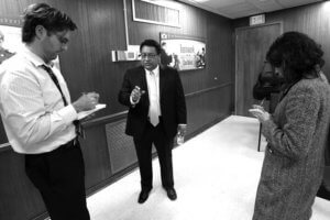 San Antonio Express-News Reporters John Tedesco and Maria Luisa Cesar interviewing Manuel Isquierdo