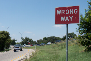 Wrong way sign on exit ramp